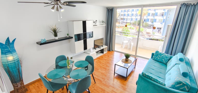 a living room with a table and chairs
