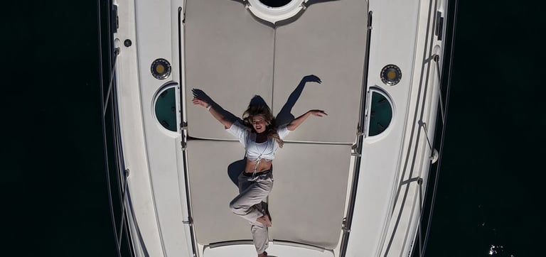 a woman standing on a boat in the water