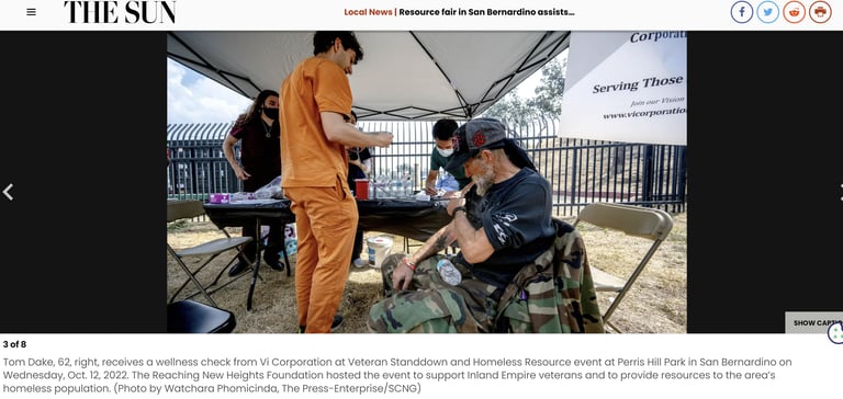 Vi Corp Volunteers Help Homeless Veterans at a community event documented by the newspaper - The Sun