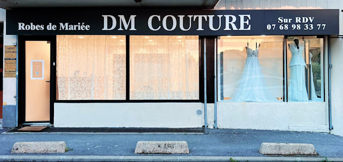 a dressmaker's dress on display in a storefront door