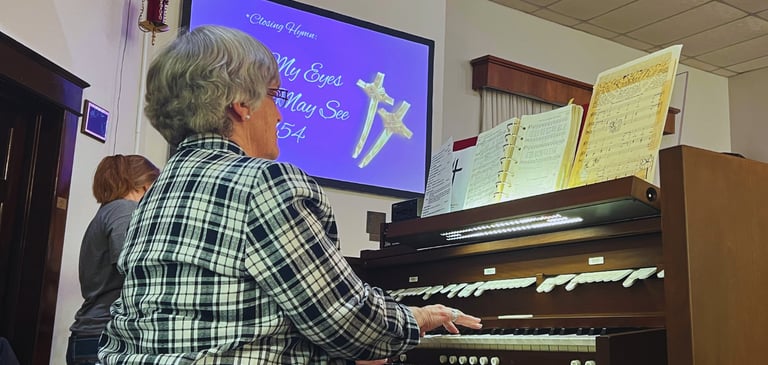 Organ being played during worship at the Moran United Methodist Church