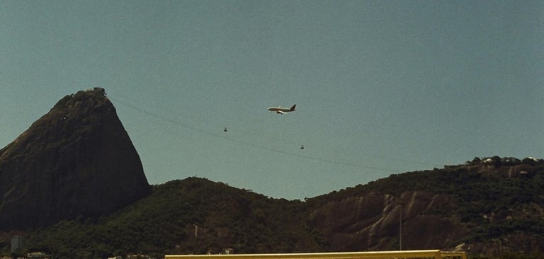 a soccer goalie on a beach with a plane flying over it