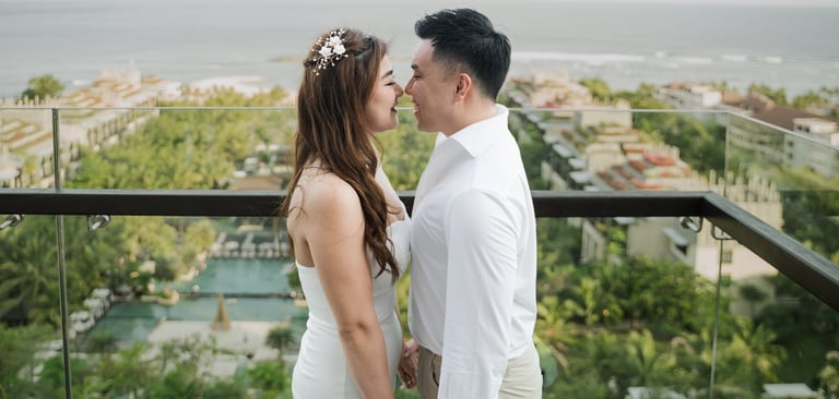 Romantic couple portrait overlooking the ocean during a prewedding photoshoot at Apurva Kempinski Bali