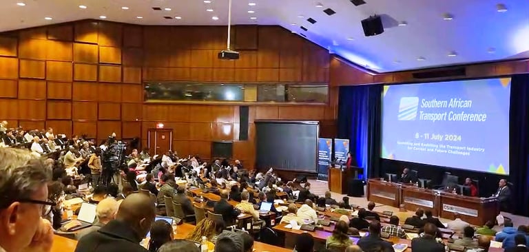 a large group of people sitting in a large room