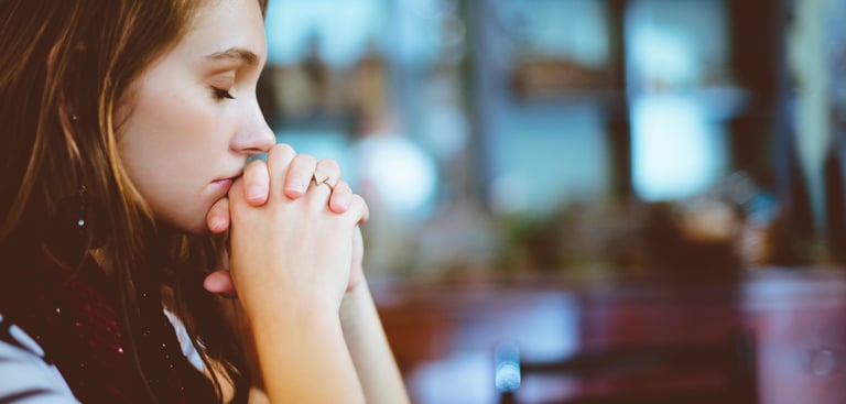 young girl praying