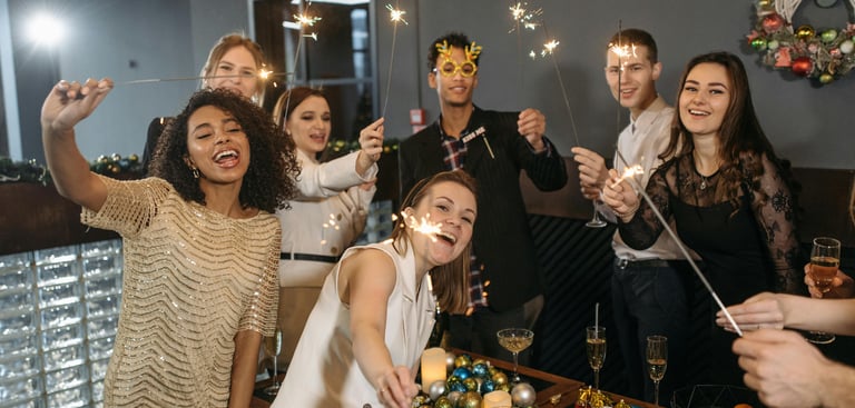 smiling partygoers at a holiday party