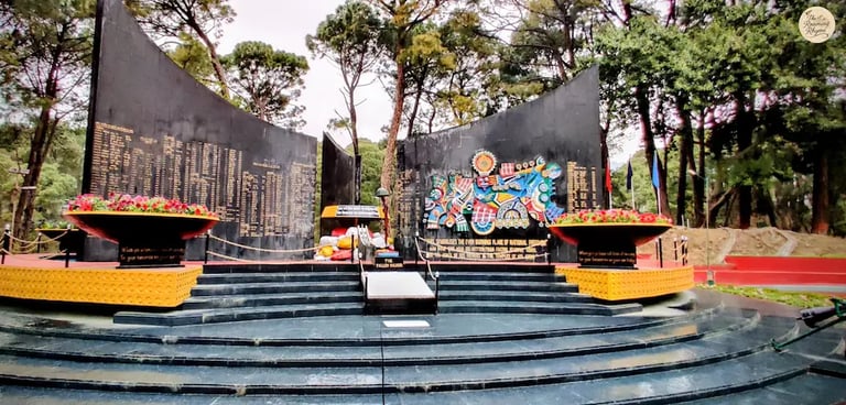 Dharamshala war memorial black marble walls.