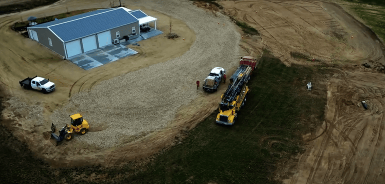 well drilling trucks at site