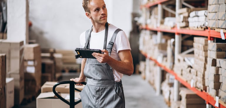 a man standing in a warehouse