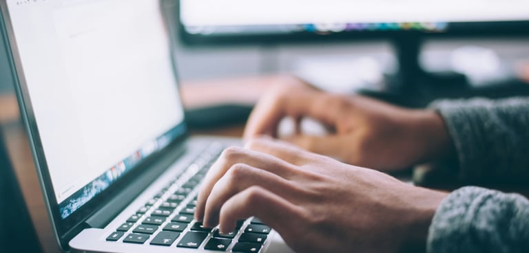 typing on a laptop