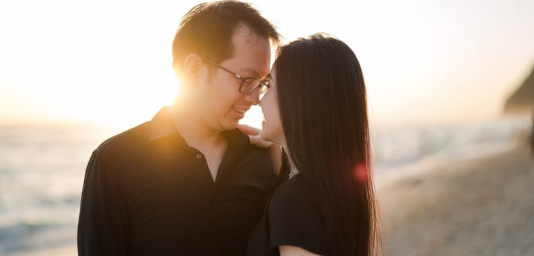 Intimate prewedding couple during golden sunset at Melasti Beach Bali