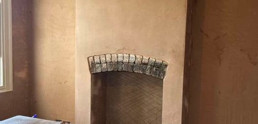 Smooth plasterwork on a residential wall by Franklins Plastering.