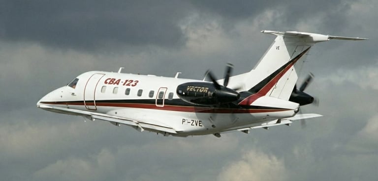 a plane flying through the air with a propeller embraer cba123