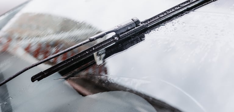 a car with a windshield and windshield wiper working