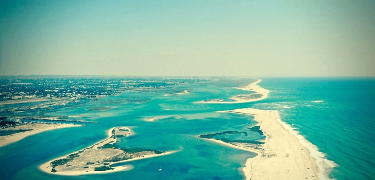 a view of a beach with a sandy beach and a sandy beach