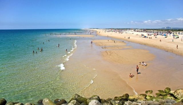a beach with people on the beach