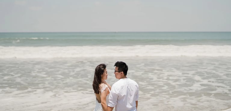 Couple sharing a quiet beach moment during a family session at W Bali Seminyak