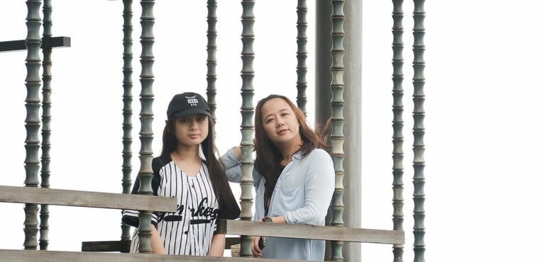 Family moment framed within architectural lines at Alila Villas Uluwatu Bali with mother and children in a calm setting