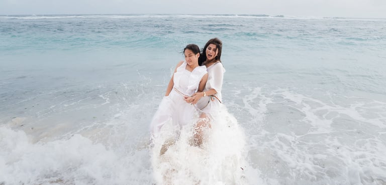 Family playing together in the ocean at Karma Kandara beach Bali  