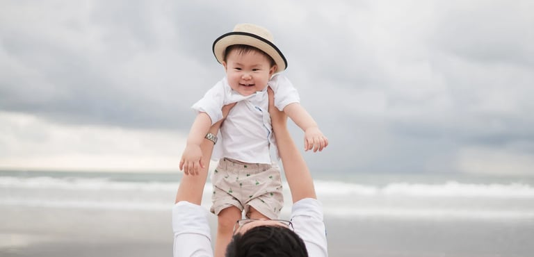 Baby portrait during multigeneration family session at Alila Seminyak Bali with soft natural beach light.