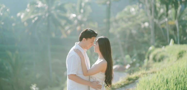 Intimate couple embrace on the hillside during a sunrise photography session at Tegalalang Ubud Bali.