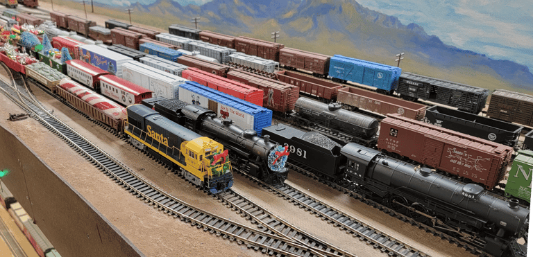 Pichacho Yard in Phoenix, Multiple trains parked decorated for Christmas.