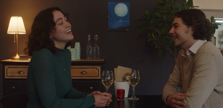 a man and woman sitting at a table
