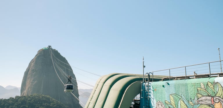 a man on a slider in the mountains