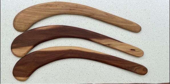 3 hunting boomerangs on a table