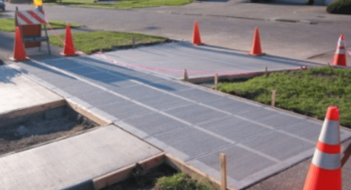 a road with orange cones and orange cones