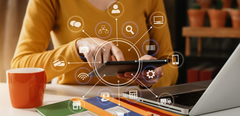 Women holding a laptop and navigating through digital advertising
