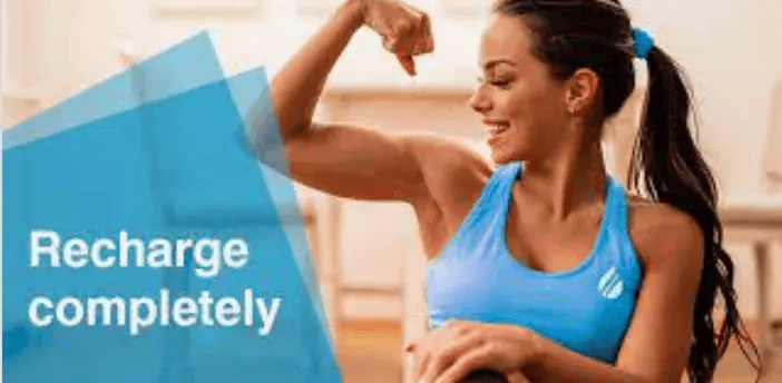 woman flexing after workout, text 'recharge completely'