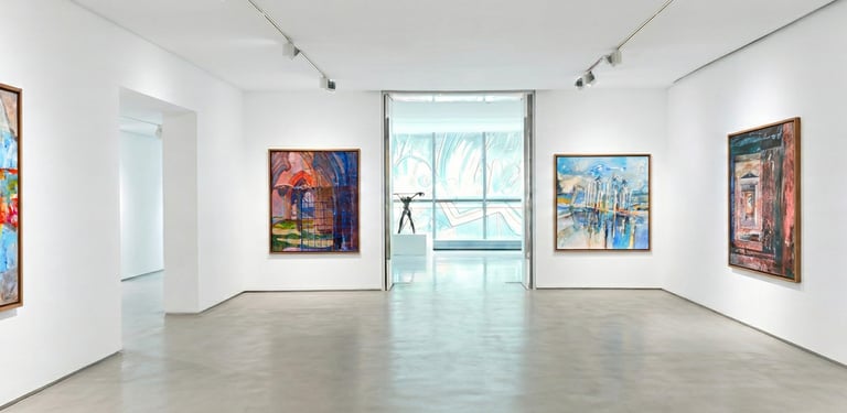 Modern white art gallery displaying colorful framed abstract paintings by Coby Hurtak.