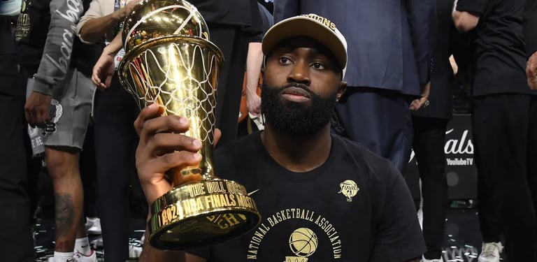 Jaylen Brown posing with his NBA Finals MVP (2024).