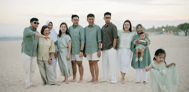 Extended family gathered together on the beach during a multigenerational family photography session in Nusa Dua Bali.