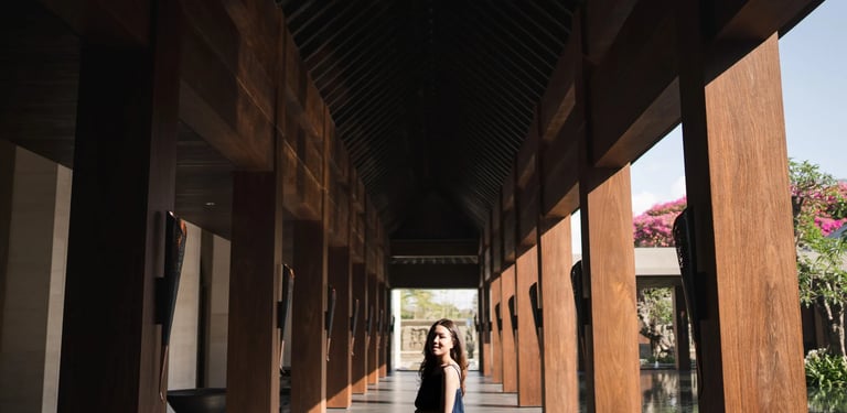 woman walking through kempinski bali corridor nusa dua
