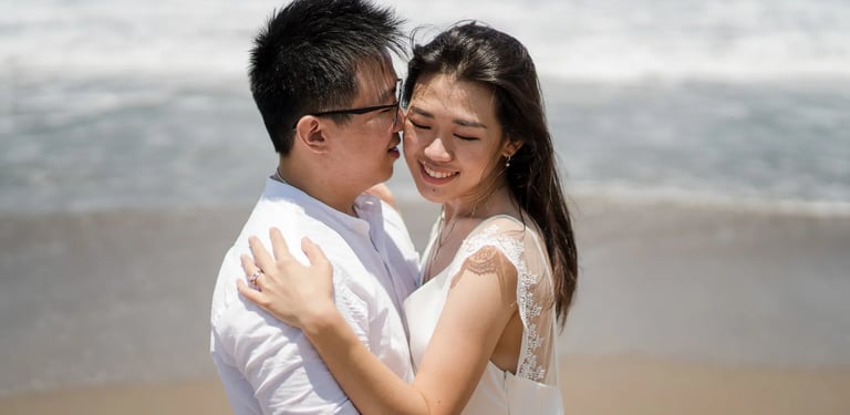 Parents embracing during a calm family photography session at Seminyak Beach Bali