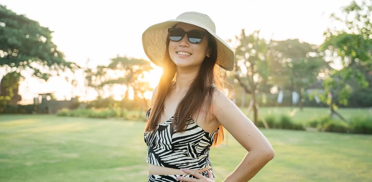 Lifestyle portrait of woman at Padma Resort Legian Bali with warm sunset light and tropical atmosphere.
