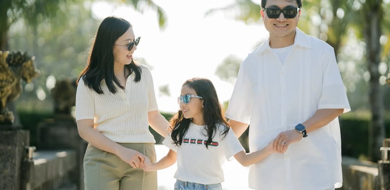Family walking together through the tropical gardens of InterContinental Bali Resort