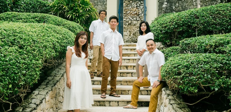 Selly family together on garden stairs at Karma Kandara Uluwatu Bali  