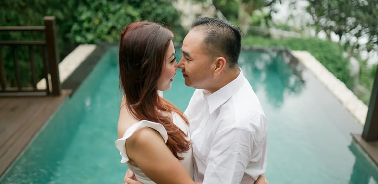 Selly couple embracing beside the pool at Karma Kandara Uluwatu Bali  