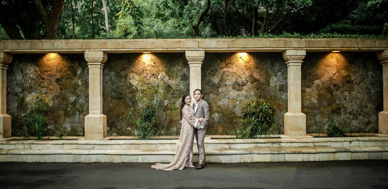 Prewedding portrait under stone arch courtyard at Amankila Karangasem Bali