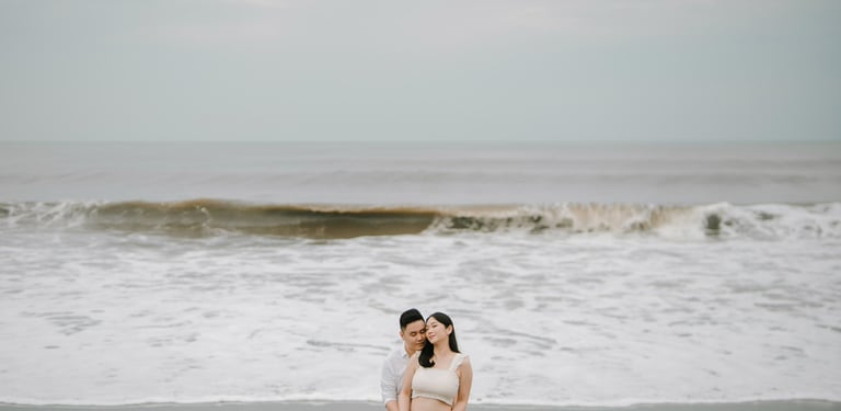 intimate couple session on Bali beach with ocean waves at sunset
