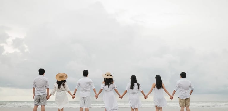 Multigeneration family silhouette at Seminyak Beach Bali captured in calm and timeless family photography atmosphere.