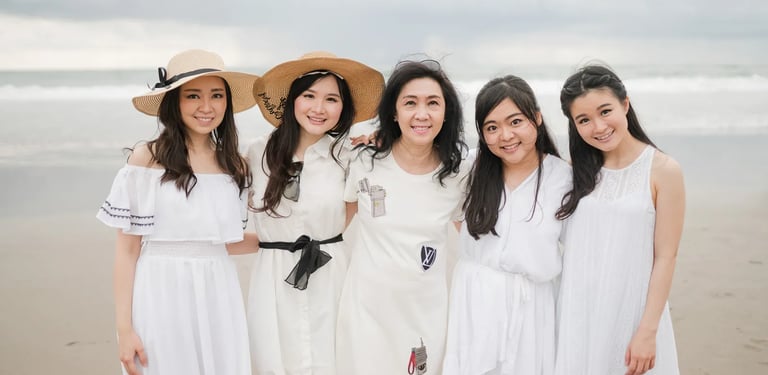 Women from multigeneration family posing together at Alila Seminyak Bali during elegant family photography session.