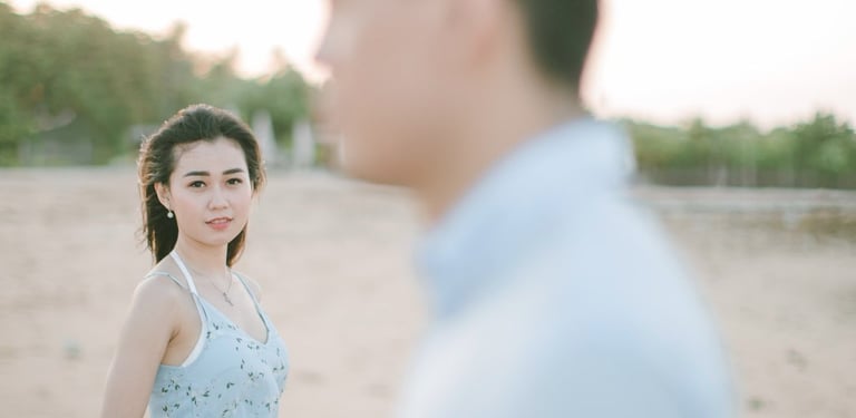 Cinematic intimate couple portrait on beach at Sofitel Bali Nusa Dua Beach Resort.