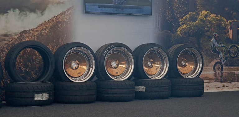 A line of wheels against a wall