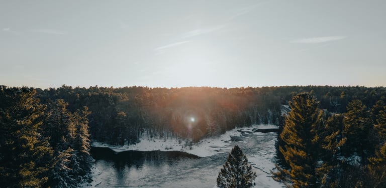 a river with a sun shining through the trees, Canada Nature
