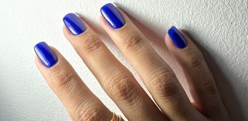 a woman's hand with a ring on her finger