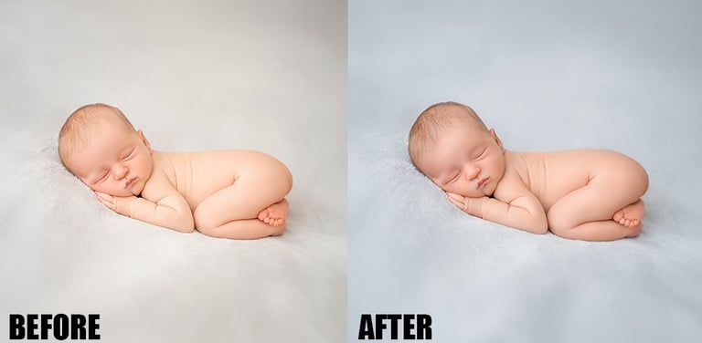 a baby sleeping on a blanket in a studio
